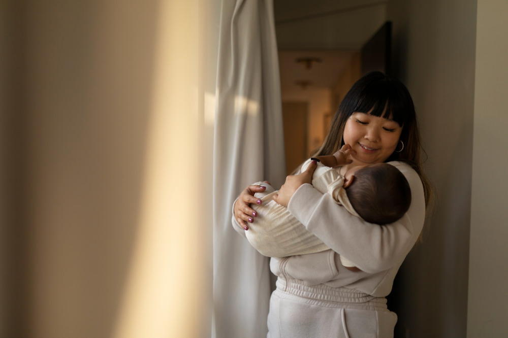 Confinement lady taking care of your baby throughout your postpartum period